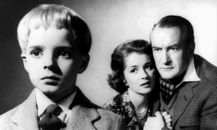 Martin Stephens with Barbara Shelley and George Sanders in Village of the Damned.