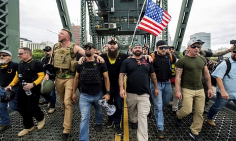 Members of the Proud Boys and other rightwing demonstrators march in Portland, Oregon in August.