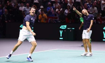 Neal Skupski and Dan Evans celebrate on court.