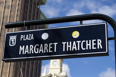 Black overhead sign reads Plaza Margaret Thatcher in white lettering.