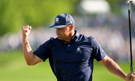 Bryson DeChambeau celebrates a birdie at the final hole