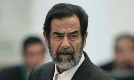 Hussein glares at prosecutors as he speaks at his trial in December 2005.
