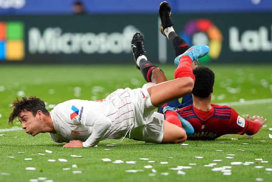 Sevilla's midfielder Oliver Torres goes down during the game against Osasuna.