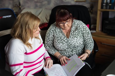 Emma Murphy and Janet Williams with the Hughes report, which recommended initial payments of £100,000 to victims and described the damage caused by valproate as ‘a bigger scandal than thalidomide’