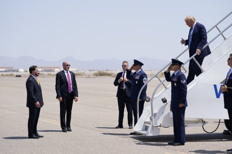 Arizona Governor Doug Ducey, left, waits as President Donald Trump exits Air Force One in Yuma, Arizona.