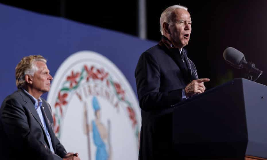 Joe Biden campaigns for the Democratic candidate for governor of Virginia, Terry McAuliffe, left, at a rally in Arlington last week.
