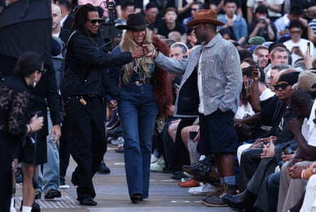 Beyoncé and Jay-Z greet people on the front row.