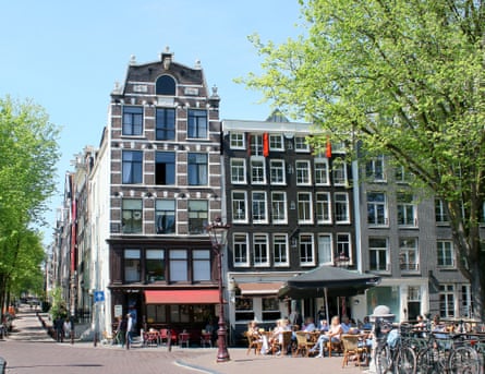 Large building in Amsterdam on a square in summer