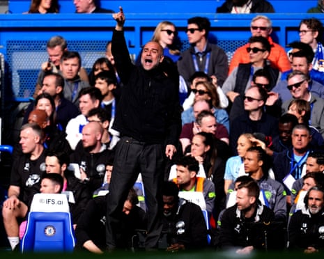 The Manchester City manager, Pep Guardiola, gestures during the Premier League match against Chelsea.