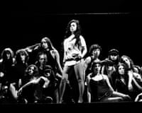 Charli XCX stands centre stage above seated performers during a dramatic black and white festival performanceHandout photo issued by Charli XCX management of Charli XCX performing on the the Grid stage during the Reading Festival, at Little John's Farm, Reading, Berkshire. Picture date: Friday August 28, 2026. PA Photo. Photo credit should read: Henry Redcliffe/PA Wire
NOTE TO EDITORS: This handout photo may only be used for editorial reporting purposes for the contemporaneous illustration of events, things or the people in the image or facts mentioned in the caption. Reuse of the picture may require further permission from the copyright holder.
