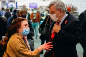 The former British prime minister, Gordon Brown, speaks with a delegate