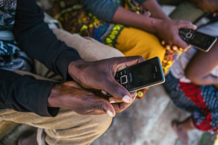 Two people holding mobile phones.