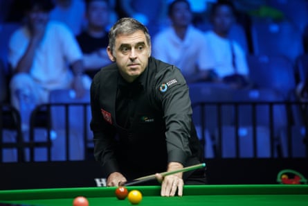 Ronnie O’Sullivan about to take a shot during a snooker match