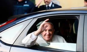 Pope Francis leaves the Regina Coeli prison in Rome after washing the feet of inmates.