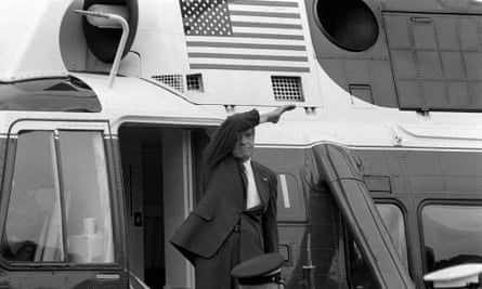 Richard Nixon waves goodbye from the steps of his helicopter as he leaves the White House following a farewell address to his staff on 9 August 1974.