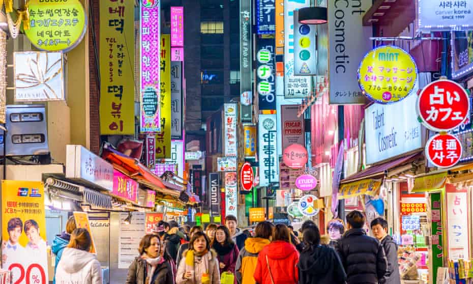 crowds in the Myeong-Dong district of Seoul.