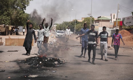 People burn tyres during a protest a day after the military seized power in Khartoum, Sudan.
