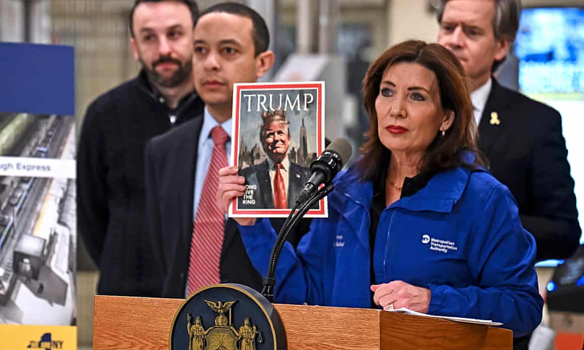 Woman holding up fake Time magazine