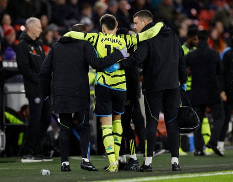 Arsenal's Gabriel Martinelli is helped off the pitch after sustaining an injury to his ankle at Sheffield United.