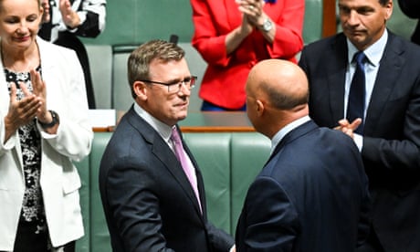 Alan Tudge shakes hands with Peter Dutton after announcing his resignation from Australia’s federal parliament