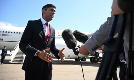 Rishi Sunak speaks with journalists in Vilnius, Lithuania