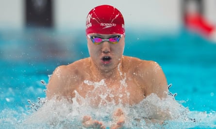 Qin Haiyang of China takes part in a heat for the men’s 100m breaststroke.