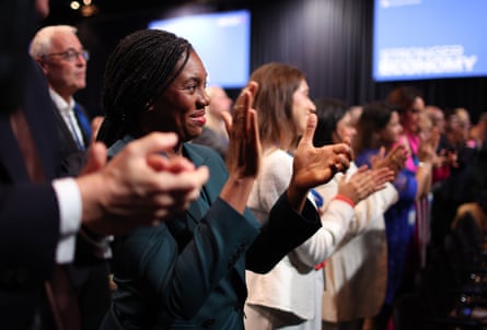Kemi Badenoch applauds during the Conservative party conference.