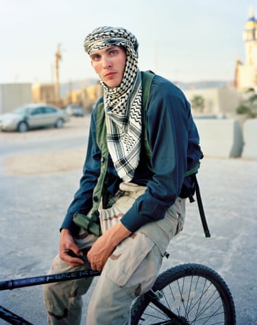Army specialist Gary Louis Sims playing the role of Safah Mehdi Faris, member of Al-Qaeda in Iraq, 2009‘The images include formal portraits, landscapes featuring makeshift buildings, and informal images of people interacting’
