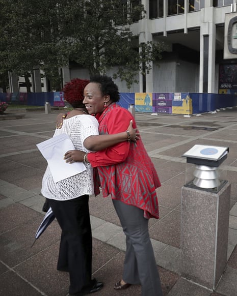 Pamela Moses seen hugging Lemichael Wilson outside City Hall during a May Day rally in 2019.