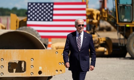 Joe Biden with machines in background