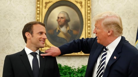 I’ll get that little piece of dandruff off, says Trump as he flicks at Macron's jacket - video