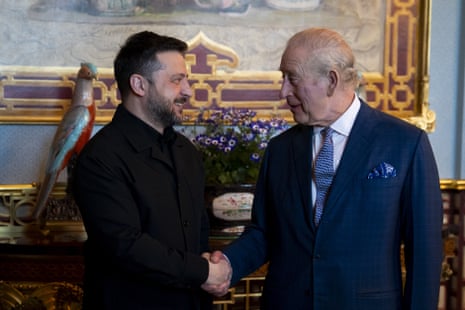 Ukrainian president Volodymyr Zelenskyy shakes hands with King Charles at Buckingham Palace.