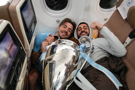 UEFA Champions League Winners Manchester City Arrive At Manchester AirportMANCHESTER, ENGLAND - JUNE 11: Manchester City’s Jack Grealish and Bernardo Silva arrive back in Manchester with the UEFA Champions League trophy on June 11, 2023 in Manchester, England. (Photo by Tom Flathers/Manchester City FC via Getty Images)