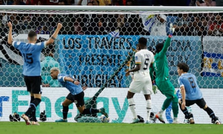 Giorgian De Arrascaeta wheels away in celebration after opening the scoring for Uruguay