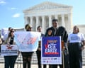 Rev William Barber II speaks at a microphone beside a 'Vote Early' sign outside the US supreme court.