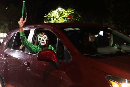 A protagonist successful a accepted Mexican disguise celebrates