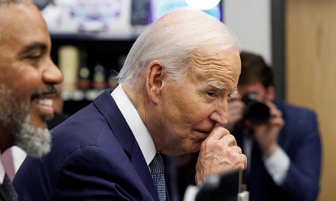 Joe Biden rubs his nose while greeting shoppers inside Mario’s Westside Market grocery store in Las Vegas, Nevada