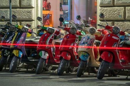Vespas parked in Rome.
