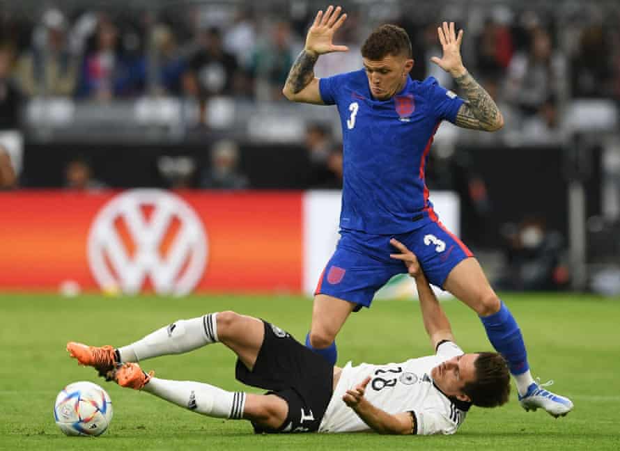 Germany's midfielder Jonas Hofmann and England's defender Kieran Trippier vie for the ball.