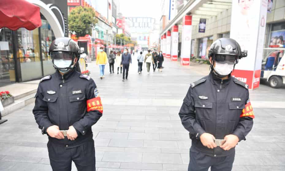 Police officers wearing smart helmets stand guard in Chengdu, Sichuan.