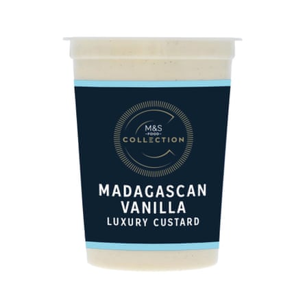 A plastic tub with a dark navy label reads "Madagascan Vanilla Luxury Custard"