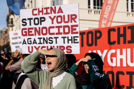 Young protesters are seen shouting slogans and holding placards