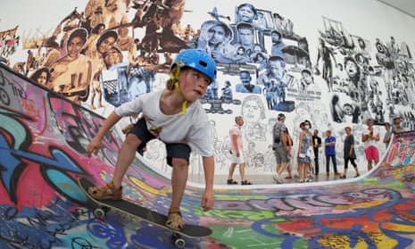 Ramped up … a boy rides a skateboard on an indoor half-pipe created by a Thai collective.
