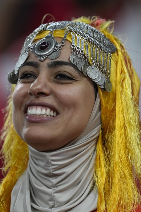 A Morocco fan beams with pre-match excitement at the Al Thumama Stadium.