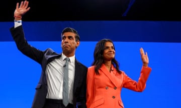 Rishi Sunak and Akshata Murty wave from the stage at the Conservative party conference