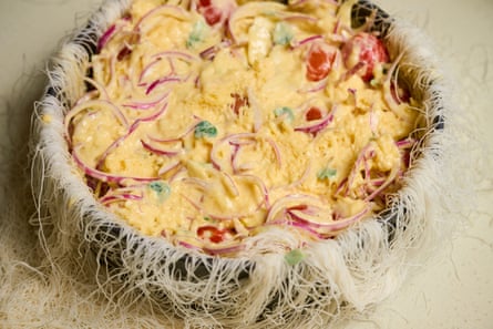 Close up of kataifi pie in progress.