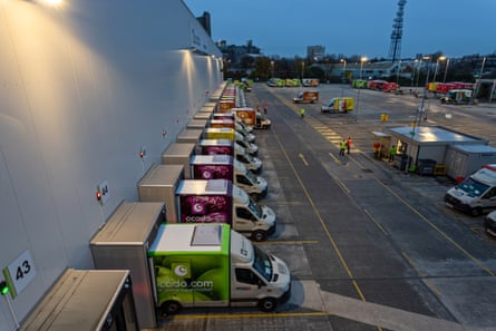 Ocado’s distinctive vans are loaded at the warehouse in Erith.