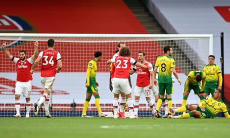 Cedric Soares of Arsenal celebrates with teammate David Luiz after scoring his team’s fourth goal.