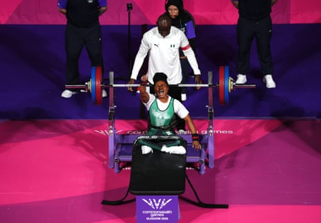 Esther Nworgu of Nigeria celebrates a new Commonwealth Games record during the Women's Lightweight Group A Para Powerlifting.