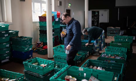 Volunteers work to put together food parcels to be distributed to clients attending the Bradford Central foodbank.